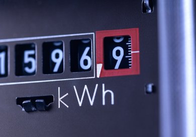 Close-up power consumption, analog electricity meter in the basement.
